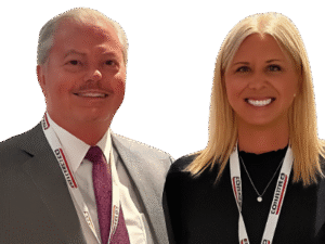 Smiling professionals wearing conference lanyards