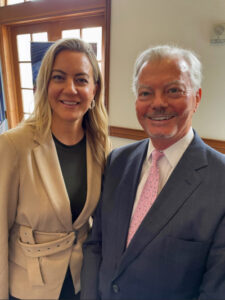 Smiling professionally dressed woman and man